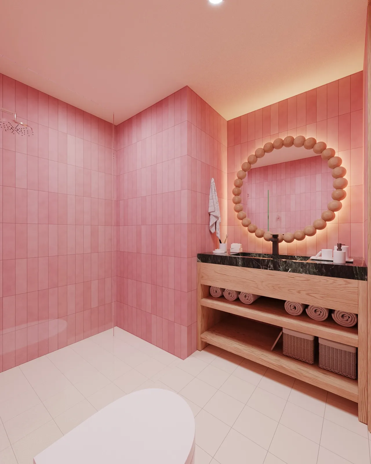 Pink tiled bathroom with wooden vanity and round mirror