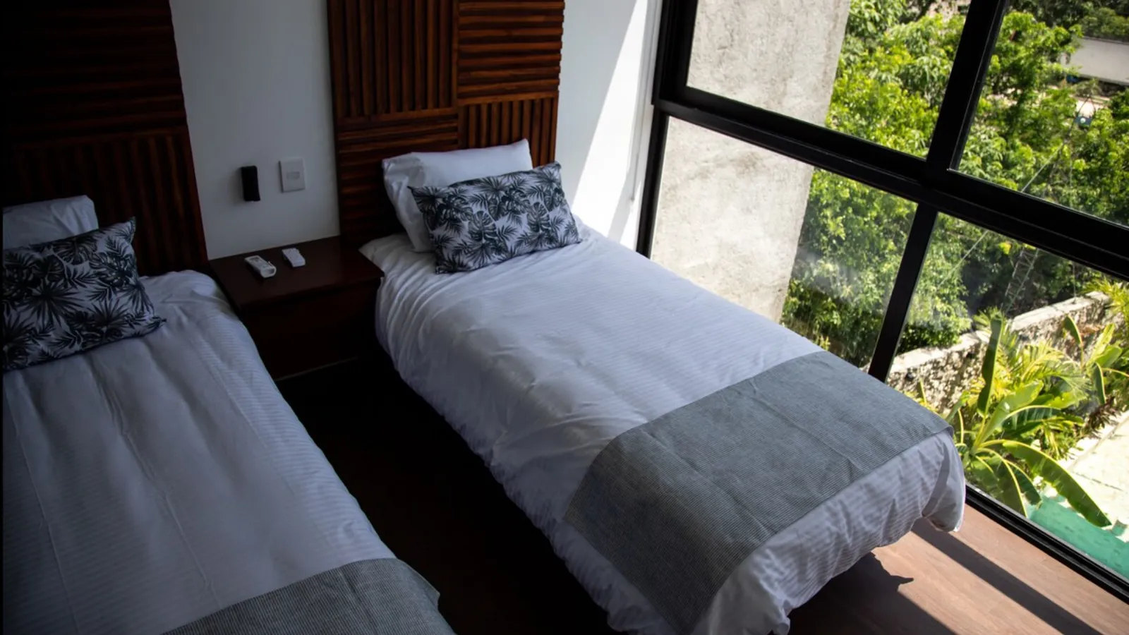 Bedroom with two twin beds and large window view