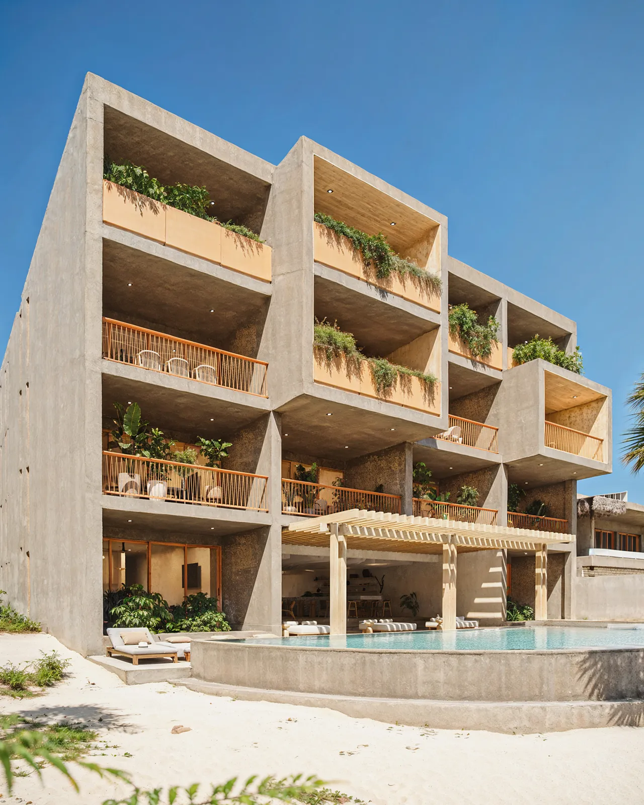 Modern concrete building with pool and balconies
