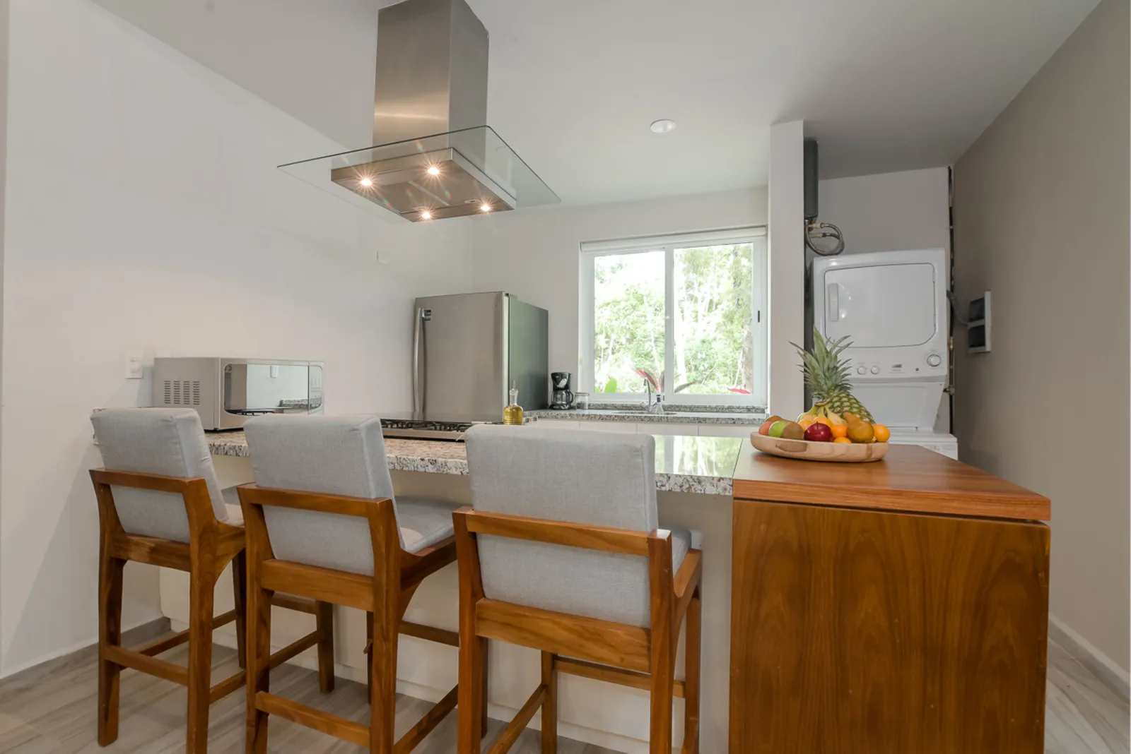 Modern kitchen with breakfast bar and stainless steel appliances