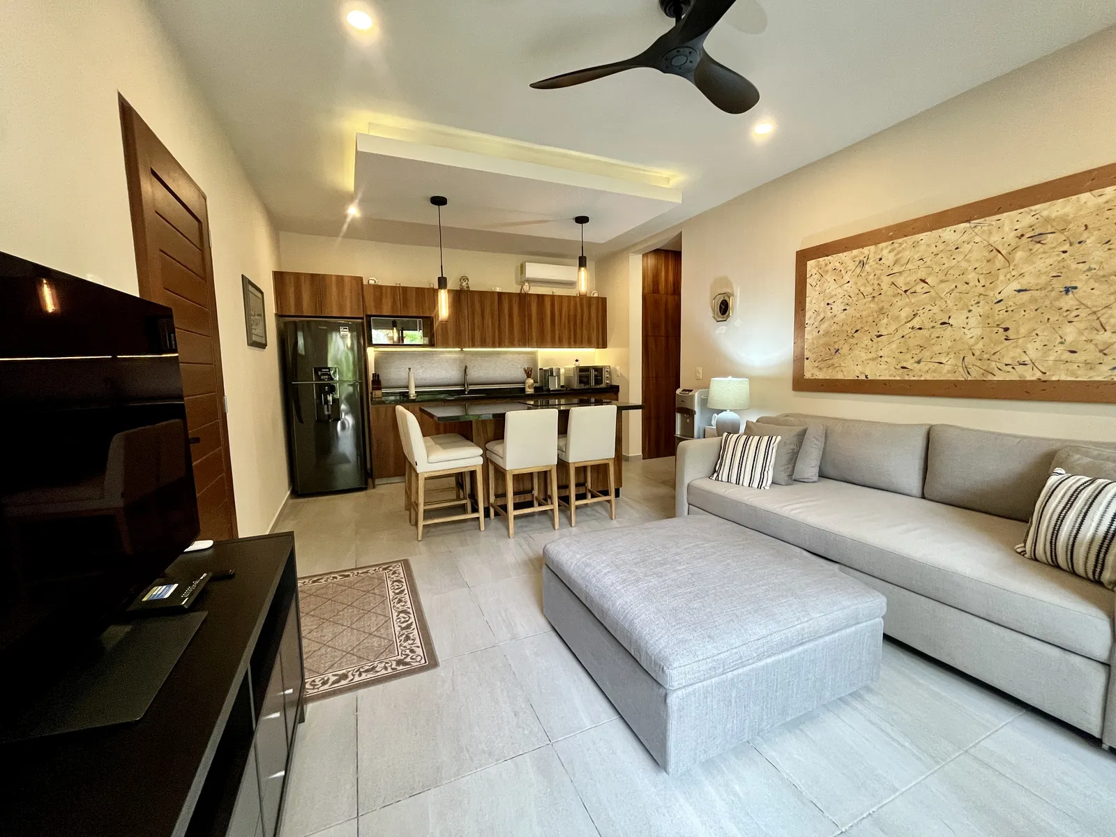 Furnished living room and kitchen in apartment unit