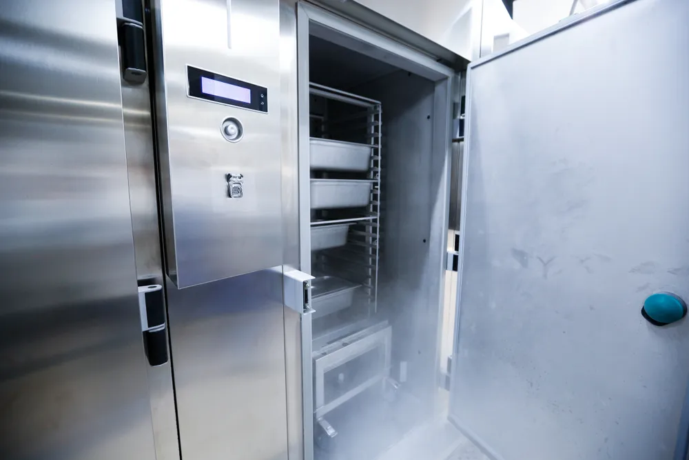 A commercial fridge with the door open