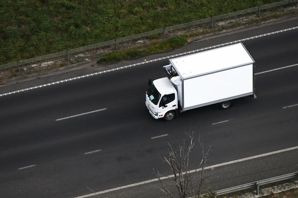 A refrigerated truck travelling along the highway