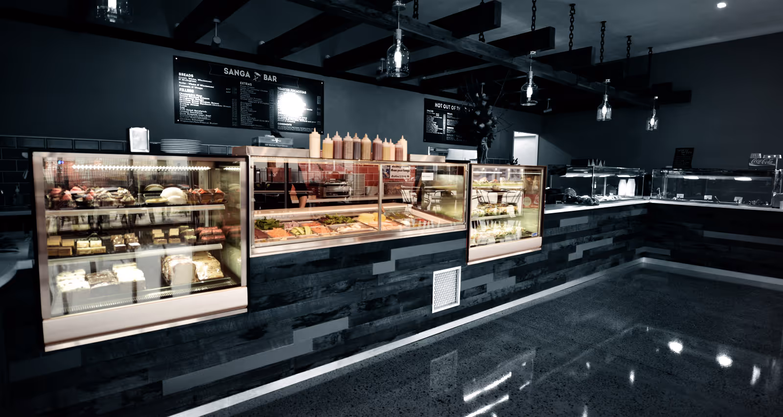 Inside a cafe with fridges 