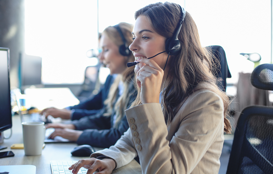 Woman with headset on and part of a CARE center