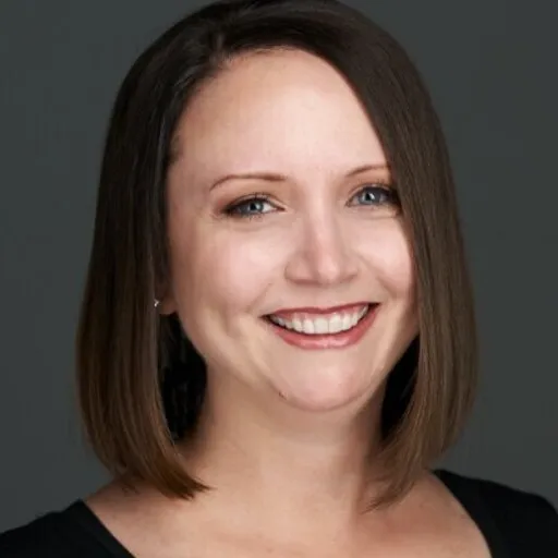 Renee, a satisfied client of Colorado Wealth Group, smiling confidently in an outdoor setting, reflecting financial security and personalized planning success.