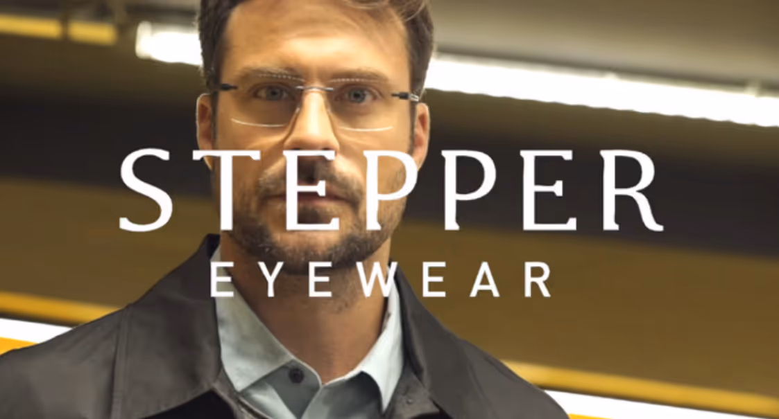 Man in glasses modeling for Stepper Eyewear advertisement