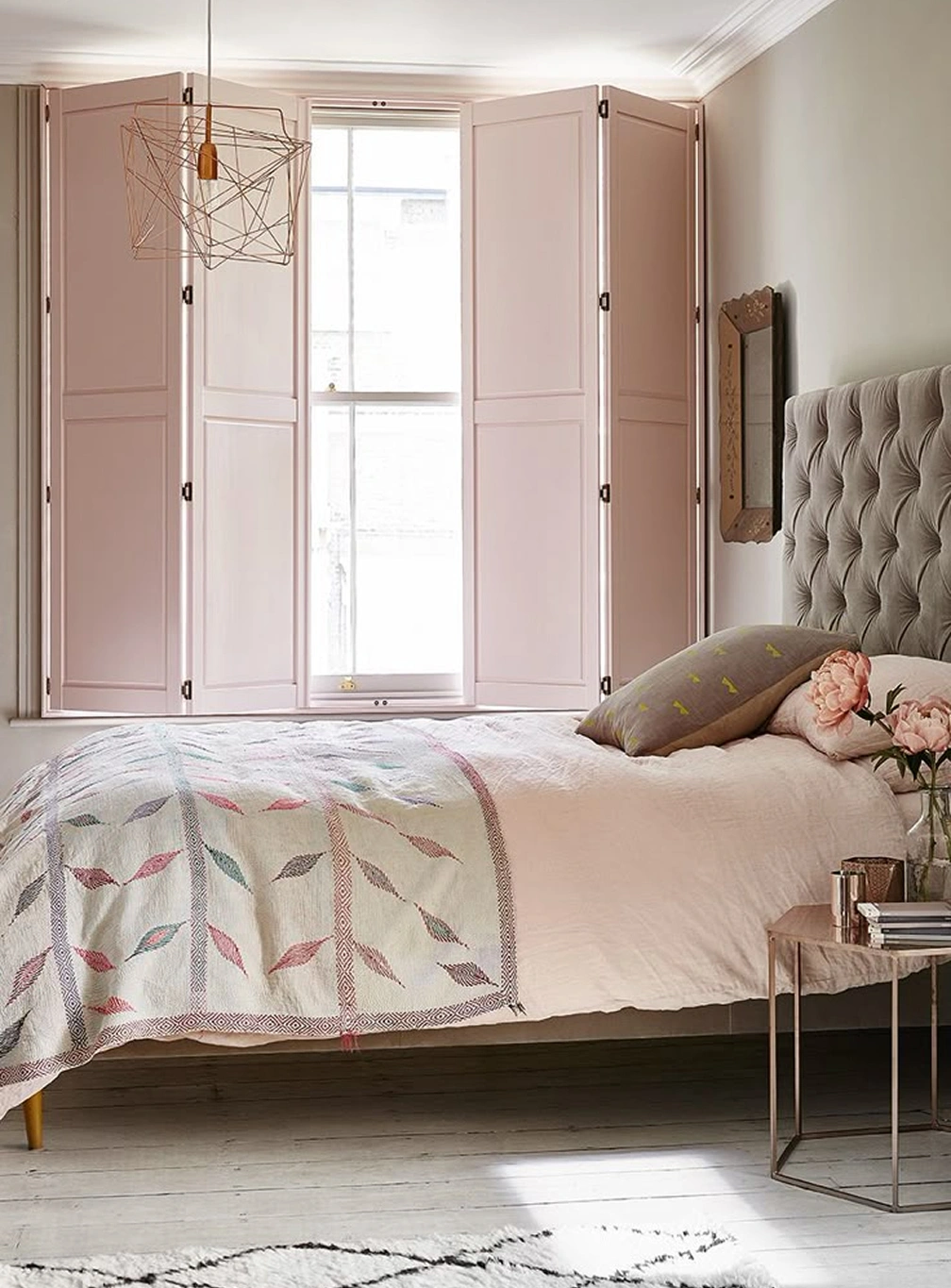 Full height solid shutters in a bedroom