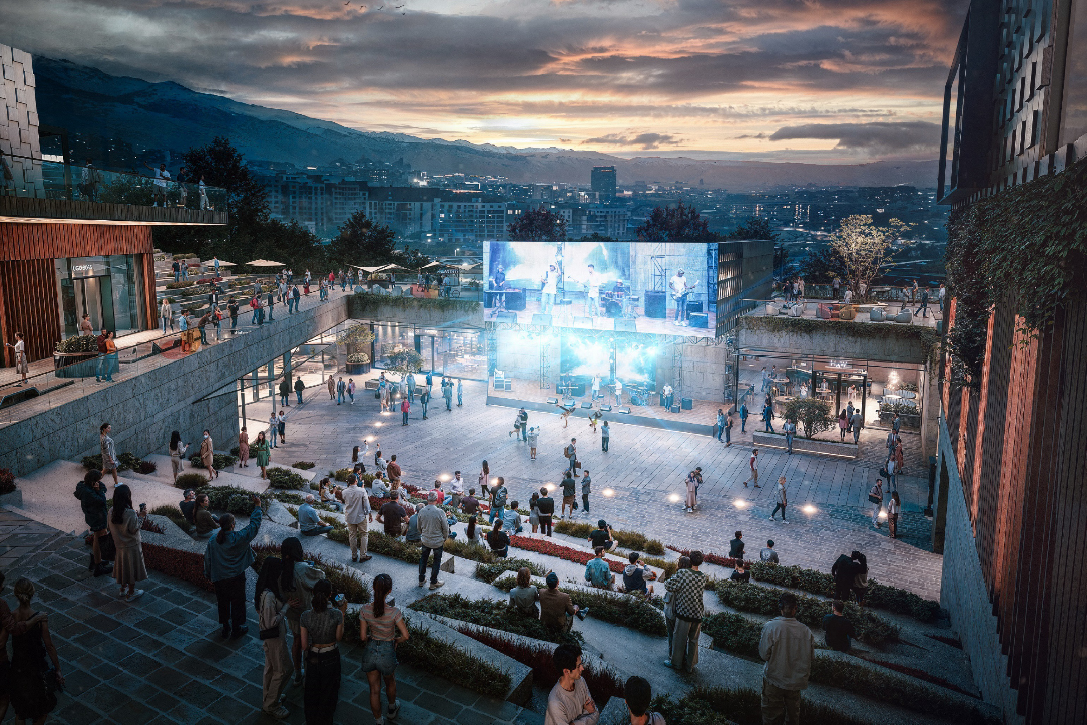 Outdoor evening concert at Almaty Hillside Outlet with band on LED-lit stage and terraced seating.