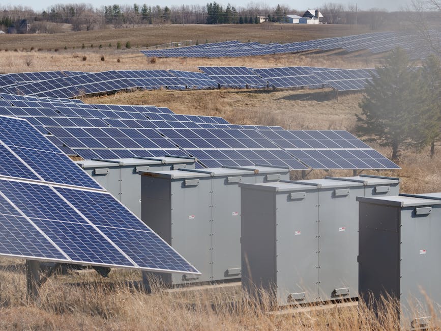 Expansive solar panel field in a rural area harnessing solar energy. Sustainable and renewable energy source.