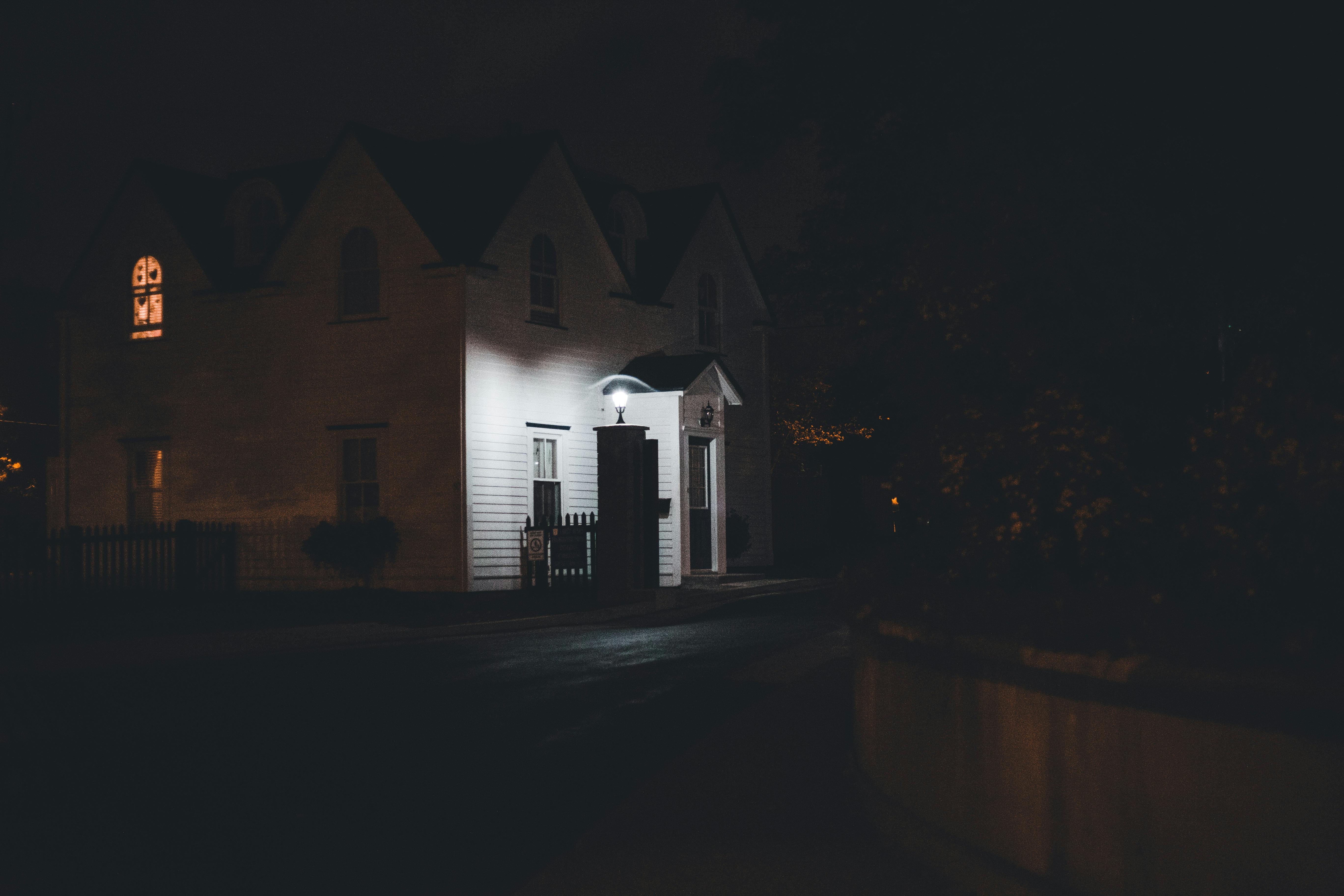 Suburban Australian house softly illuminated at night, evoking the moment a battery keeps essential lights and circuits on during a power blackout.