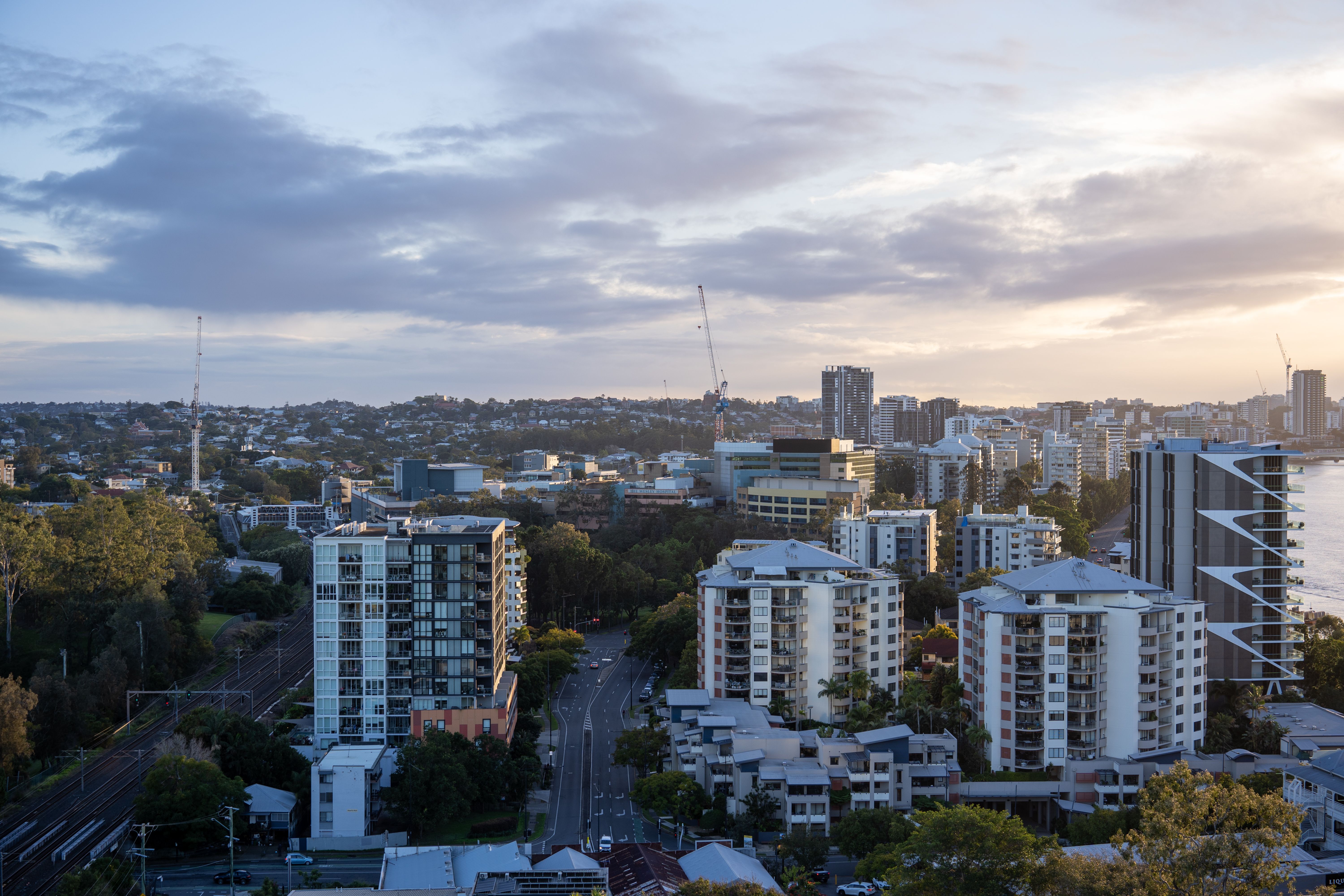 Aerial view of commercial buildings in Brisbane at dusk, the kind of Australian business sites where interval data and tariff choices reduce energy costs.