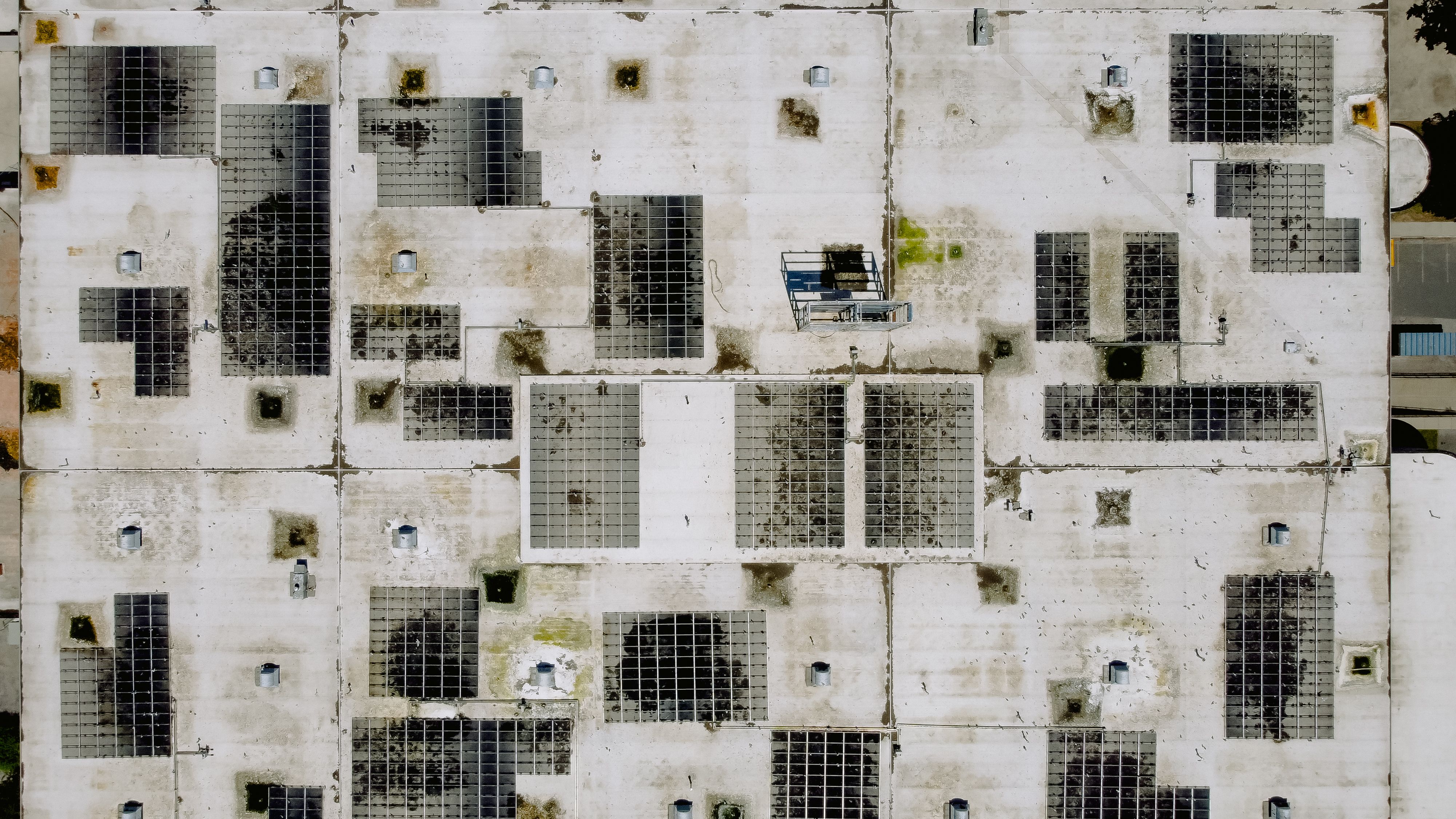Aerial view of solar panels on an industrial rooftop, the kind of Australian commercial site where solar trends translate into real energy strategy.