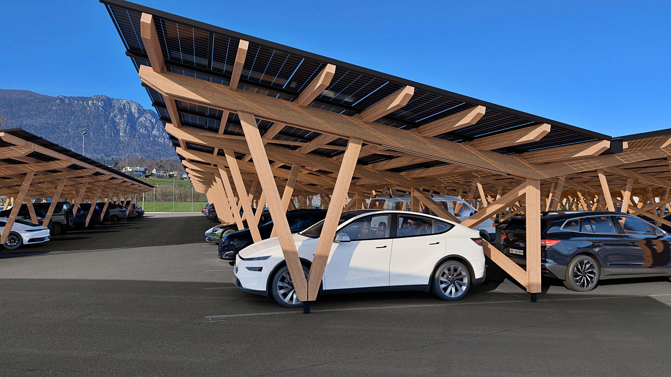 Ein Solar Carport aus Holz, der den neu gestalteten Parkplatz aufwertet und die Gemeinde und ihre Einwohner mit lokal erzeugtem Strom versorgt.
