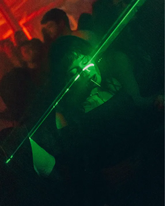 Girl dancing at DAS HAUSFEST with neon laser light