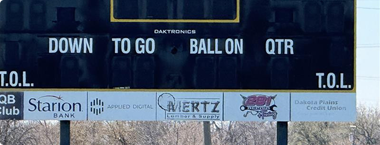 a view of a high school football scoreboard donated by the Applied Digital company