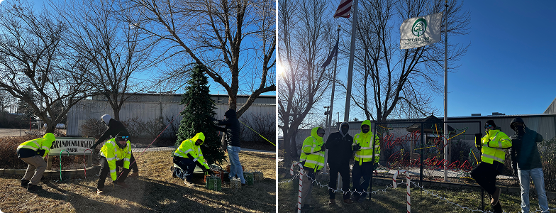 team members putting up holiday lights