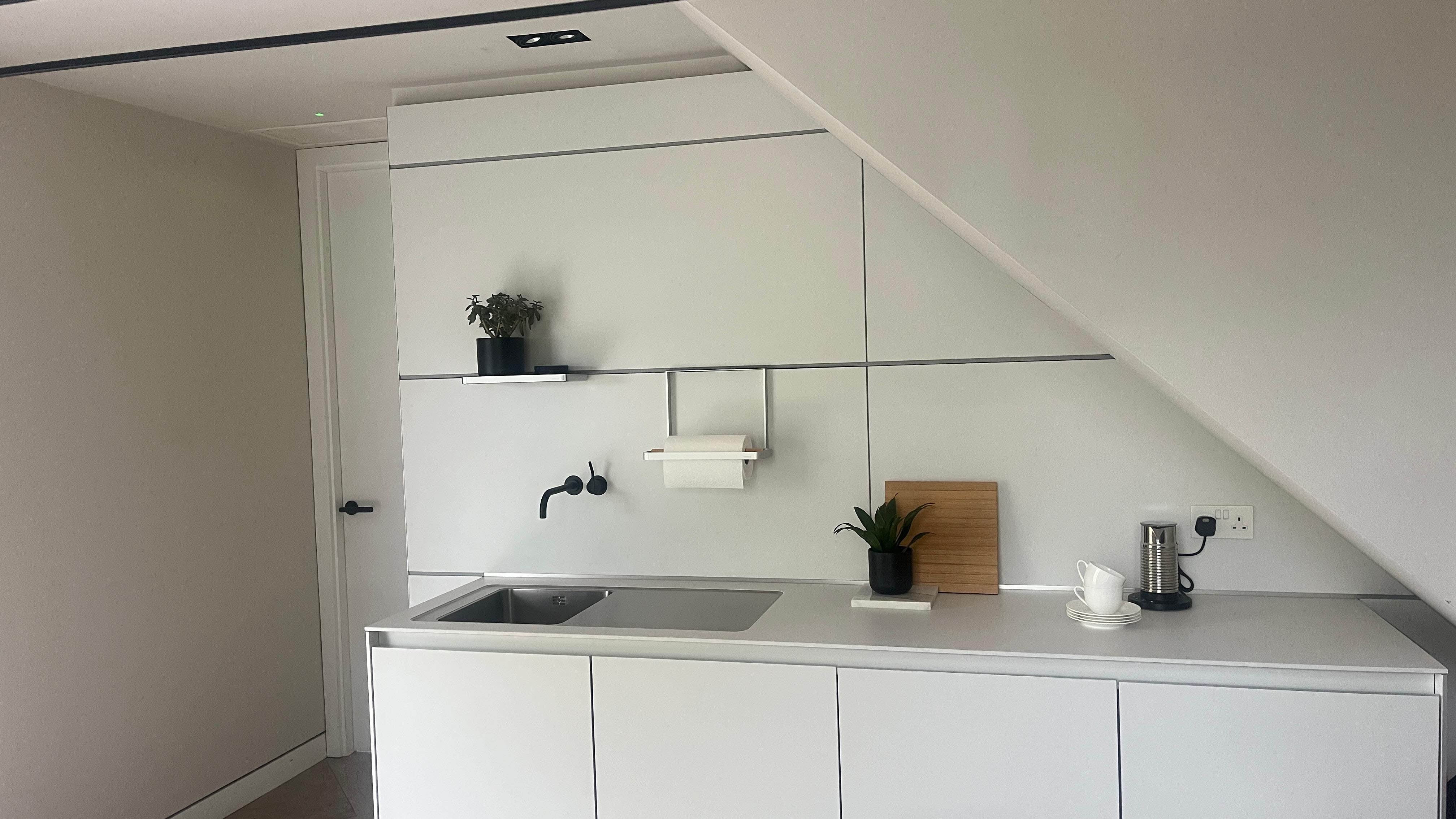 b3 furniture in kaolin laminate with Siemens appliances and a bulthaup sink.