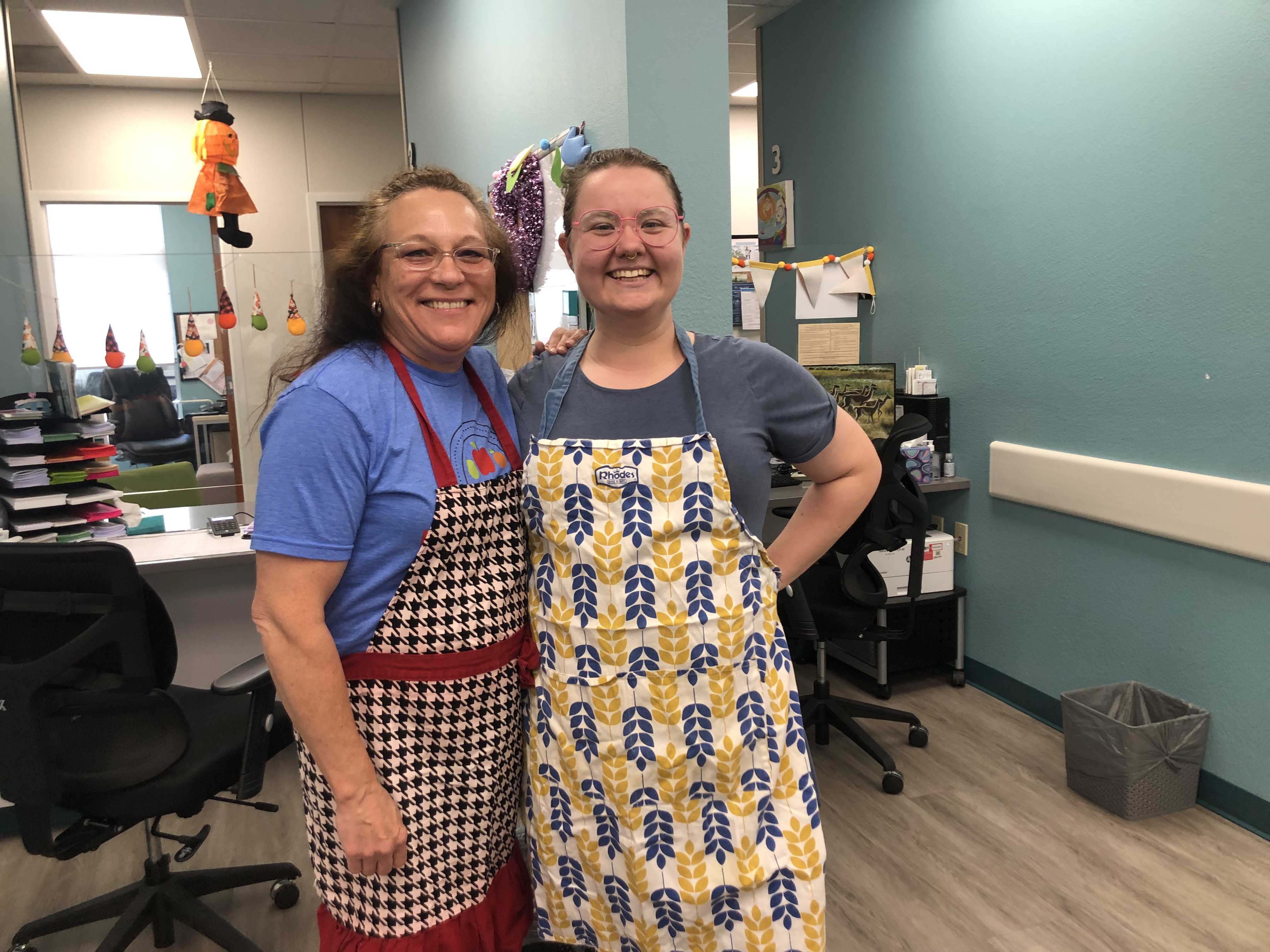 two women in aprons