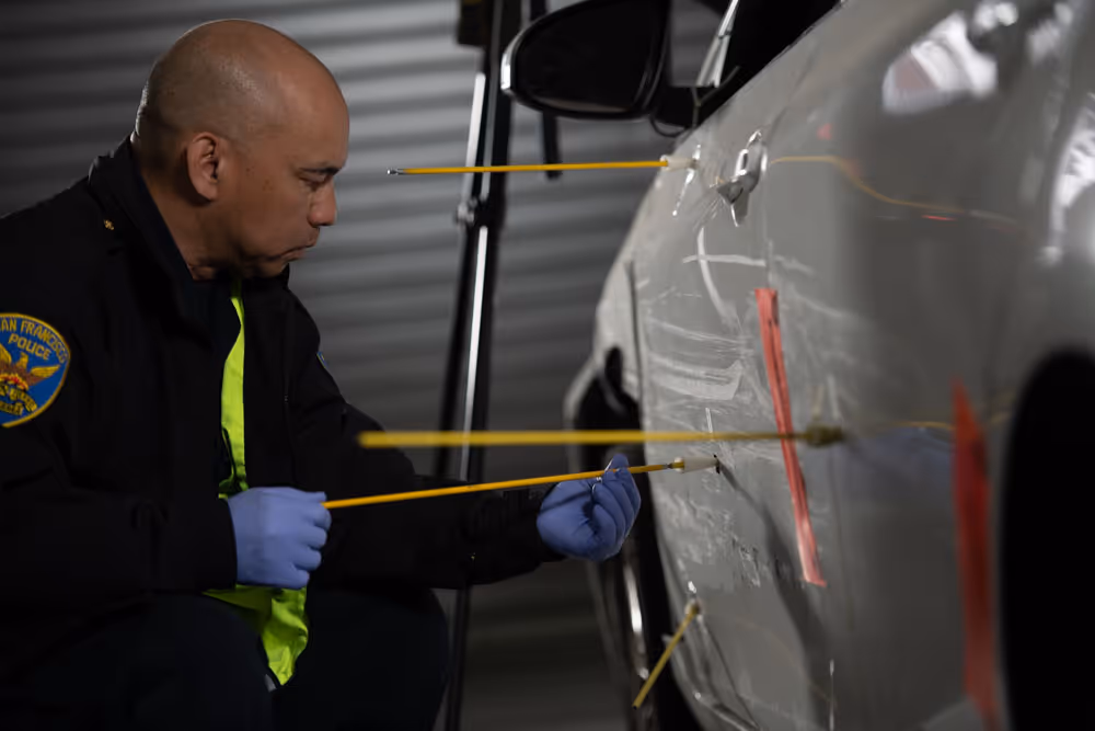 A man check the scratches on a car