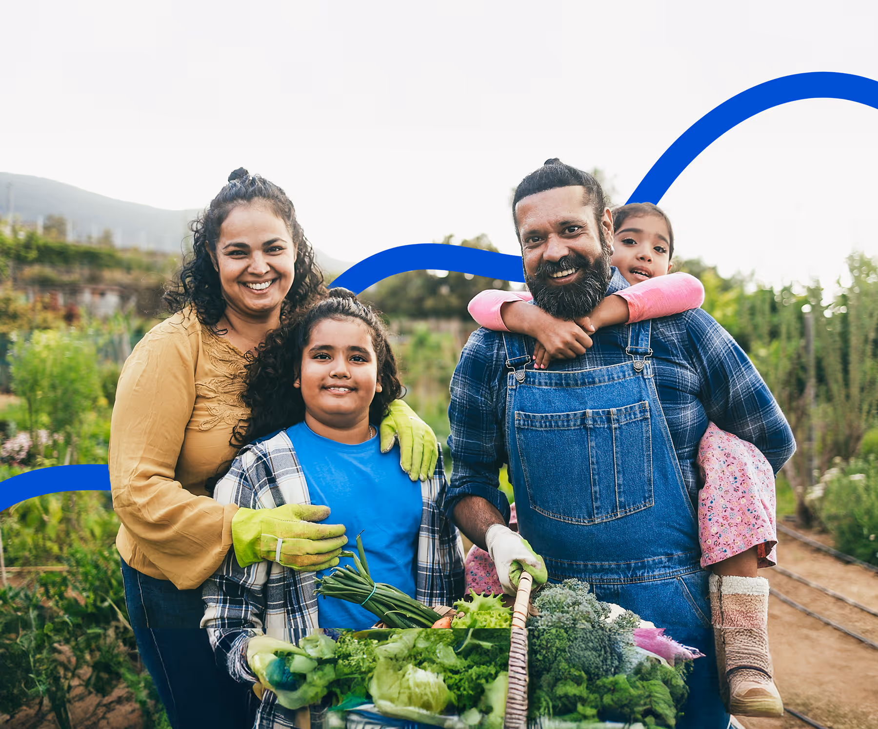 A family smiling in a garden