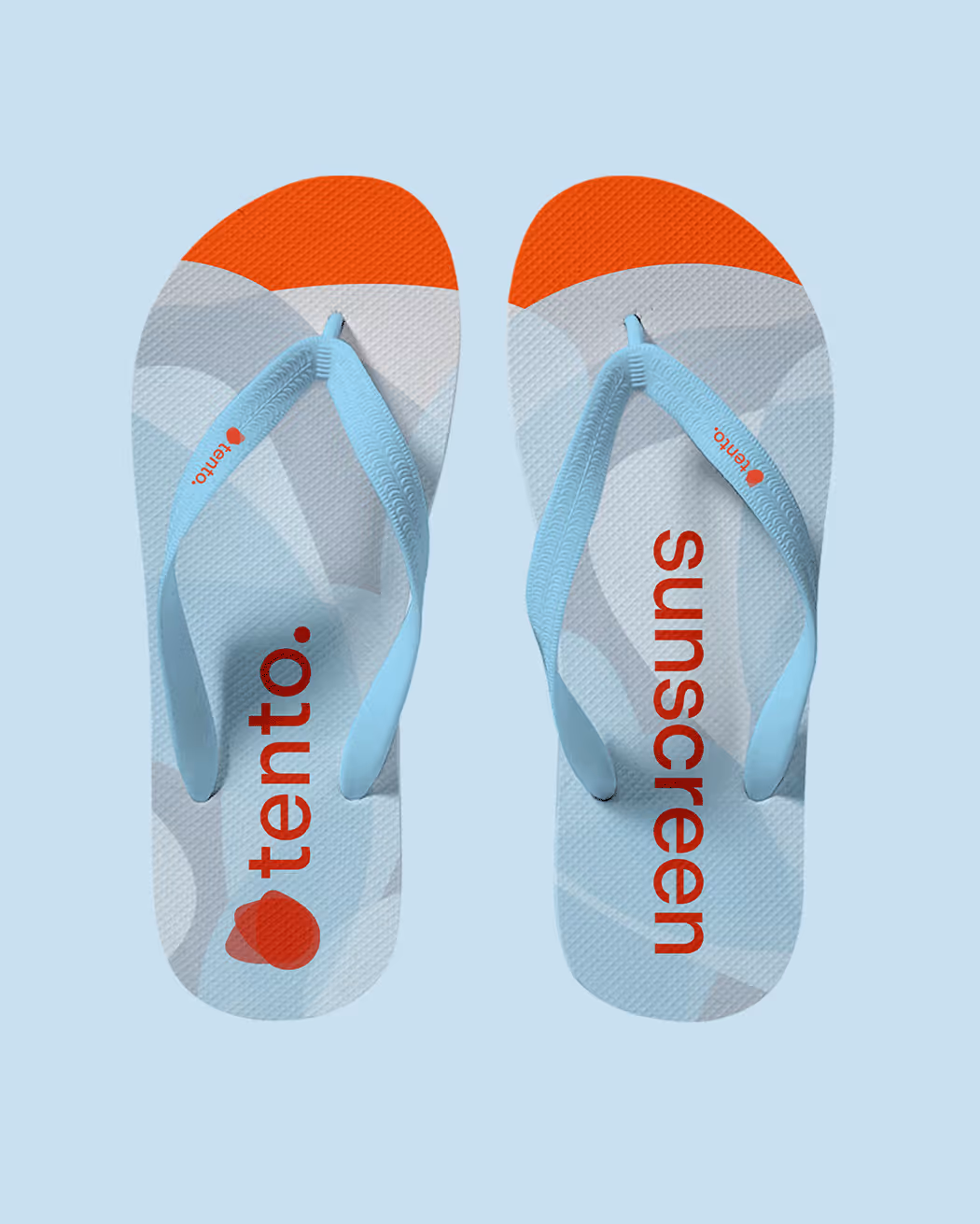 Light blue flip flops with orange toes and red “tento” and “sunscreen” text, promoting Tento Skincare sunscreen.