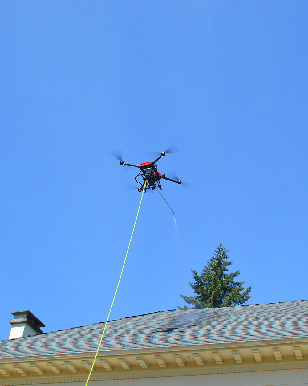 Cleaning drone used by StratosClear to soft wash a roof in Metro Vancouver