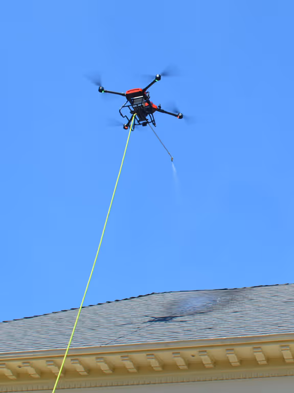 Cleaning drone used by StratosClear to soft wash a roof in Metro Vancouver