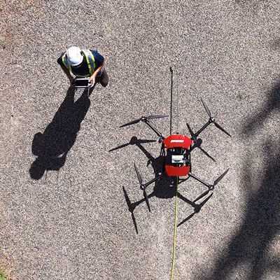 stratosclear drone pressure washing a large truck
