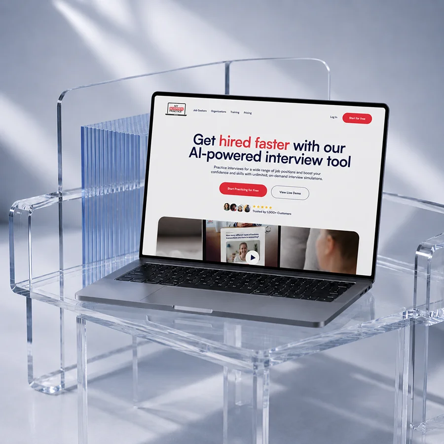 Laptop on clear acrylic chair shows 'Your Interview is Ready' screen for video practice with AI feedback.