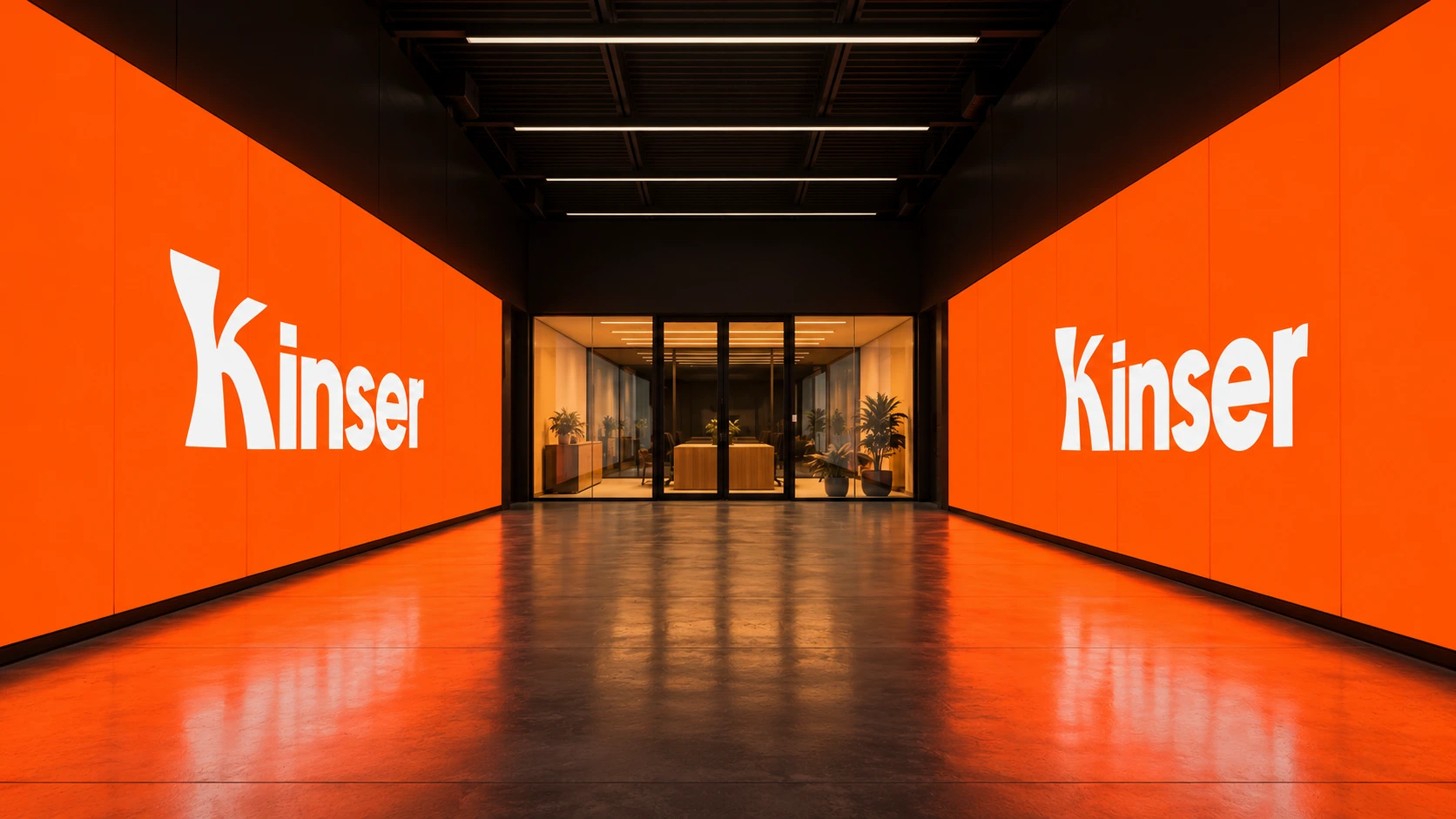 Symmetrical corridor with polished floor reflecting two large bright orange LED walls displaying the white word Kinser on each side, leading to a glass-walled office space with plants and warm lighting.