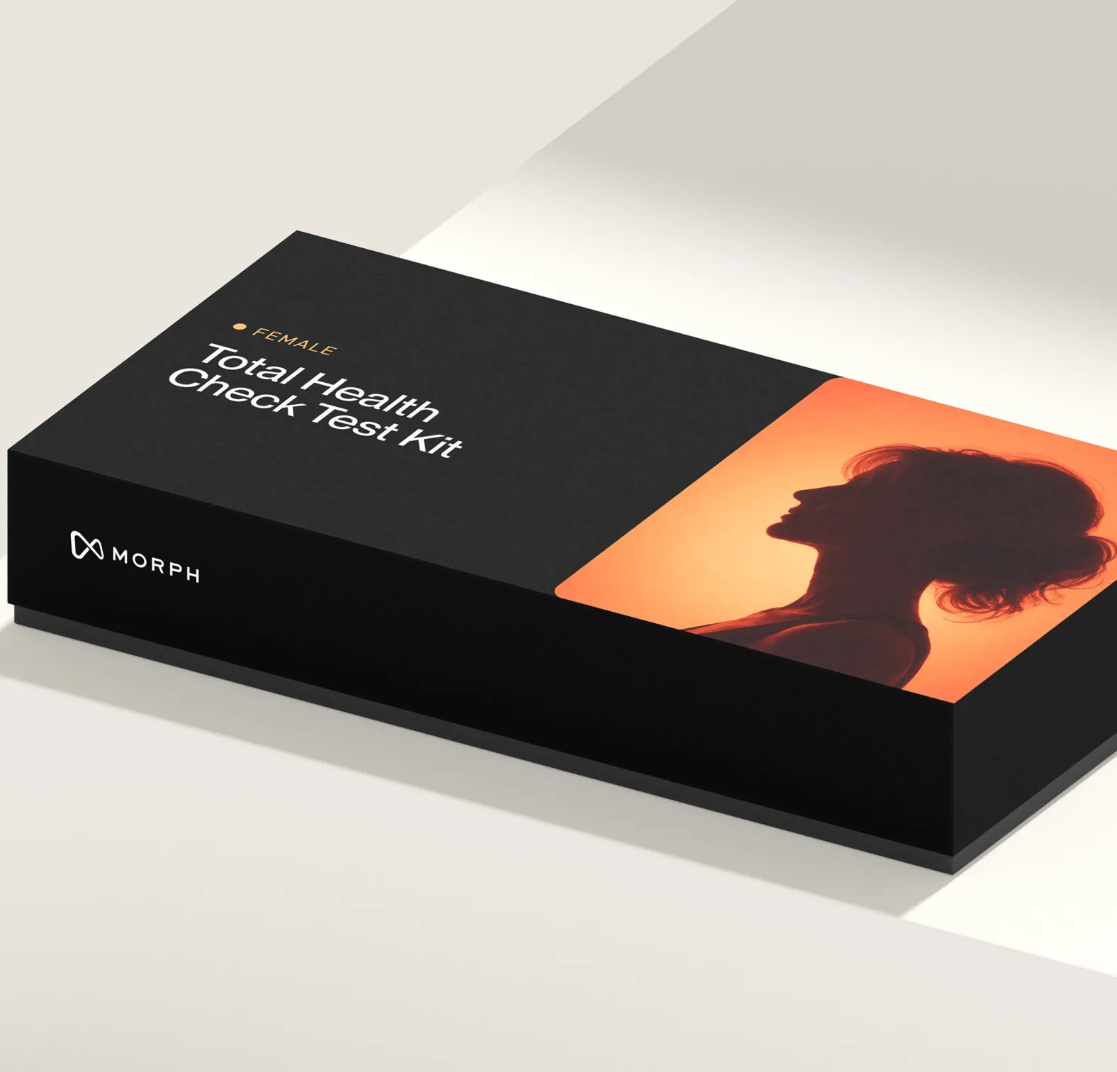 Black box labeled 'Female Total Health Check Test Kit' with a silhouette of a woman on an orange background.