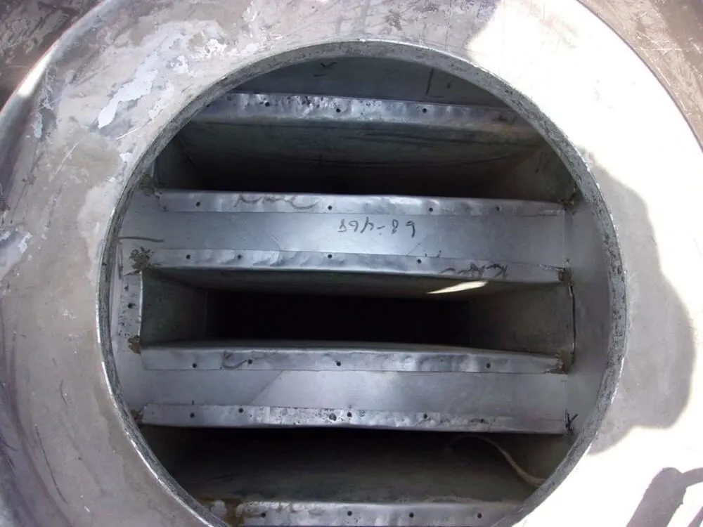 A close-up view inside a clean, metal dryer vent after cleaning