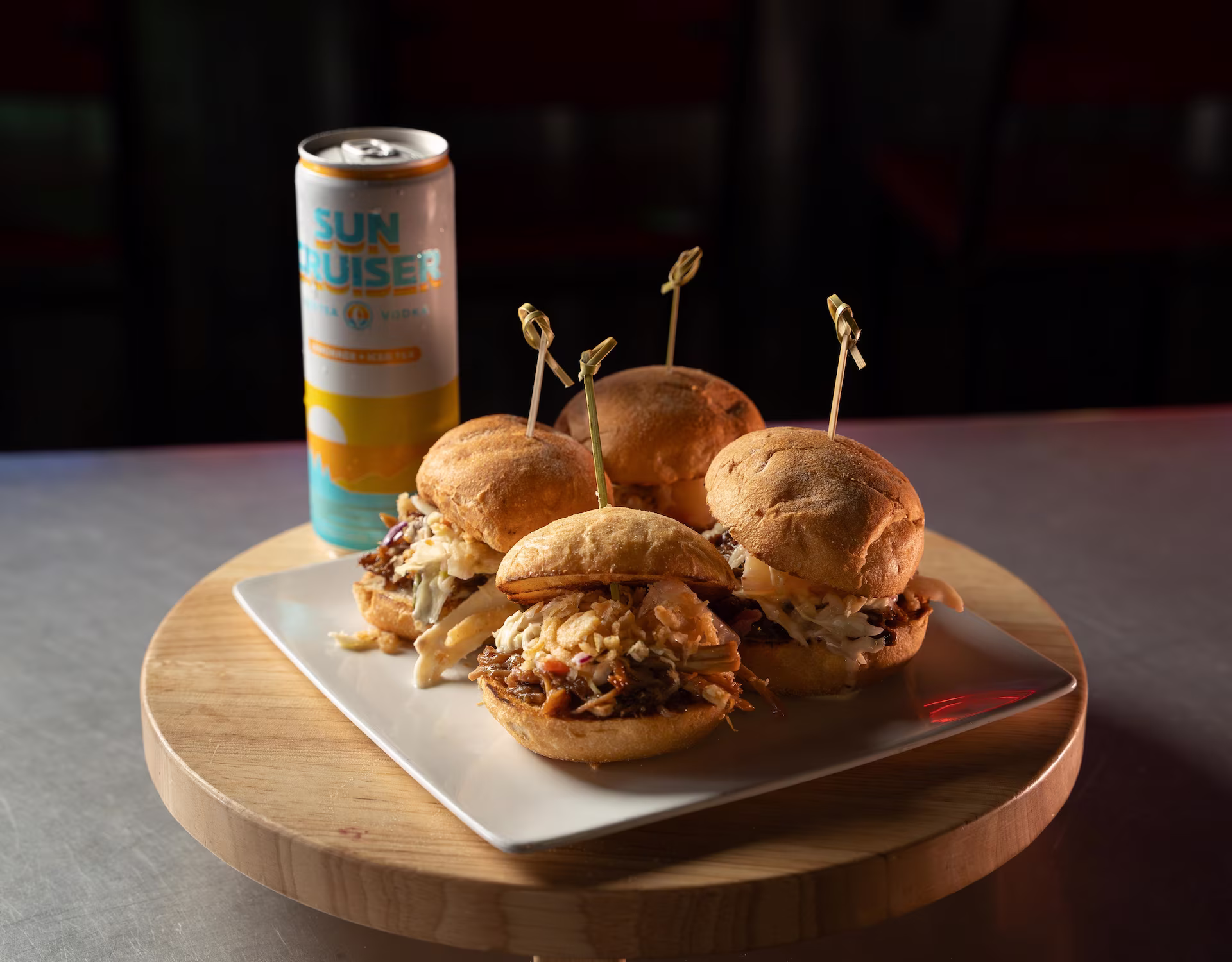 Korean BBQ fried chicken sandwich with cucumber, kimchi, lettuce, and wasabi aioli on a brioche bun at Crafty Squirrel