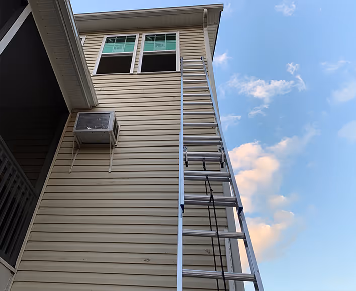 Window and siding install on two story home