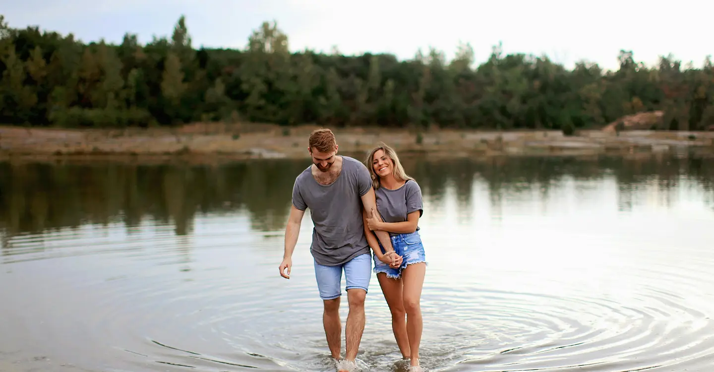 Happy couple together in shallow water.