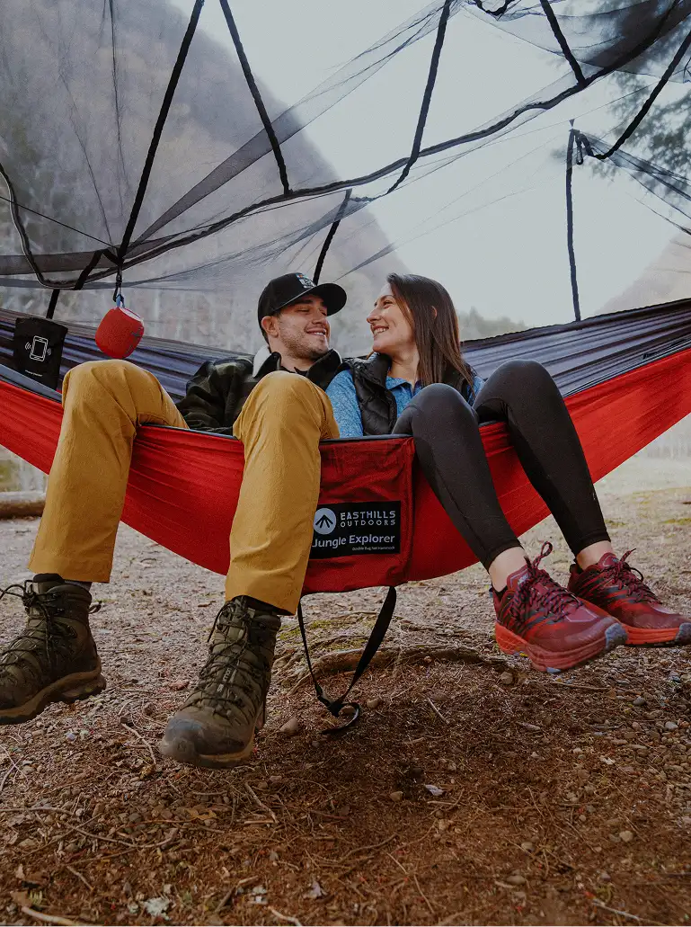 Couple hanging out in a hammock.