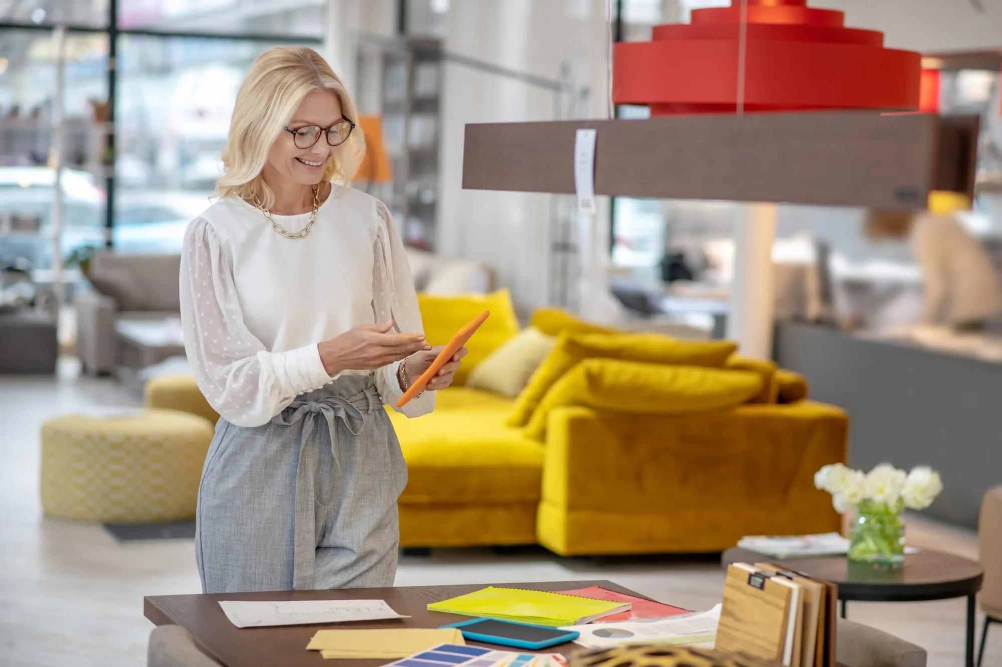 interior designer showing clients furniture swatches