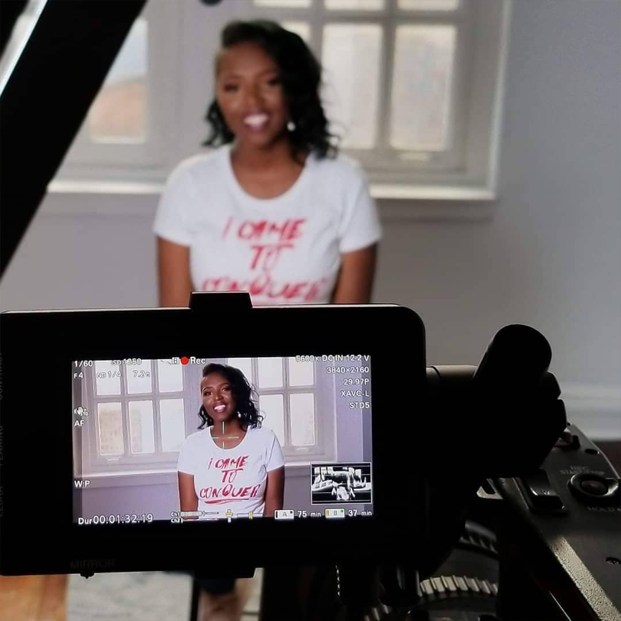 Behind the scenes shot of African American woman being interviewed