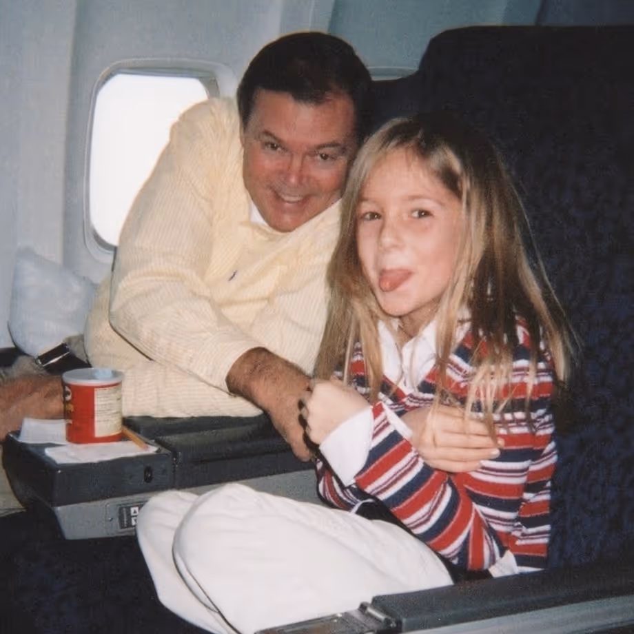 Jackie Pulice of 851 Travel as a young girl in first class on an airplane