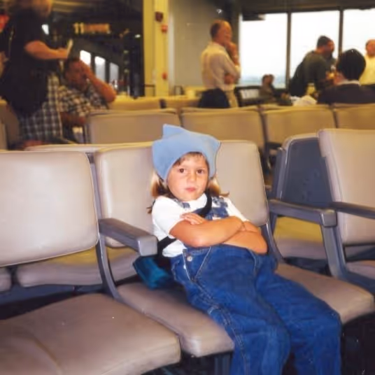 Jackie Pulice of 851 Travel as a young girl grumpy when she got bumped off a flight