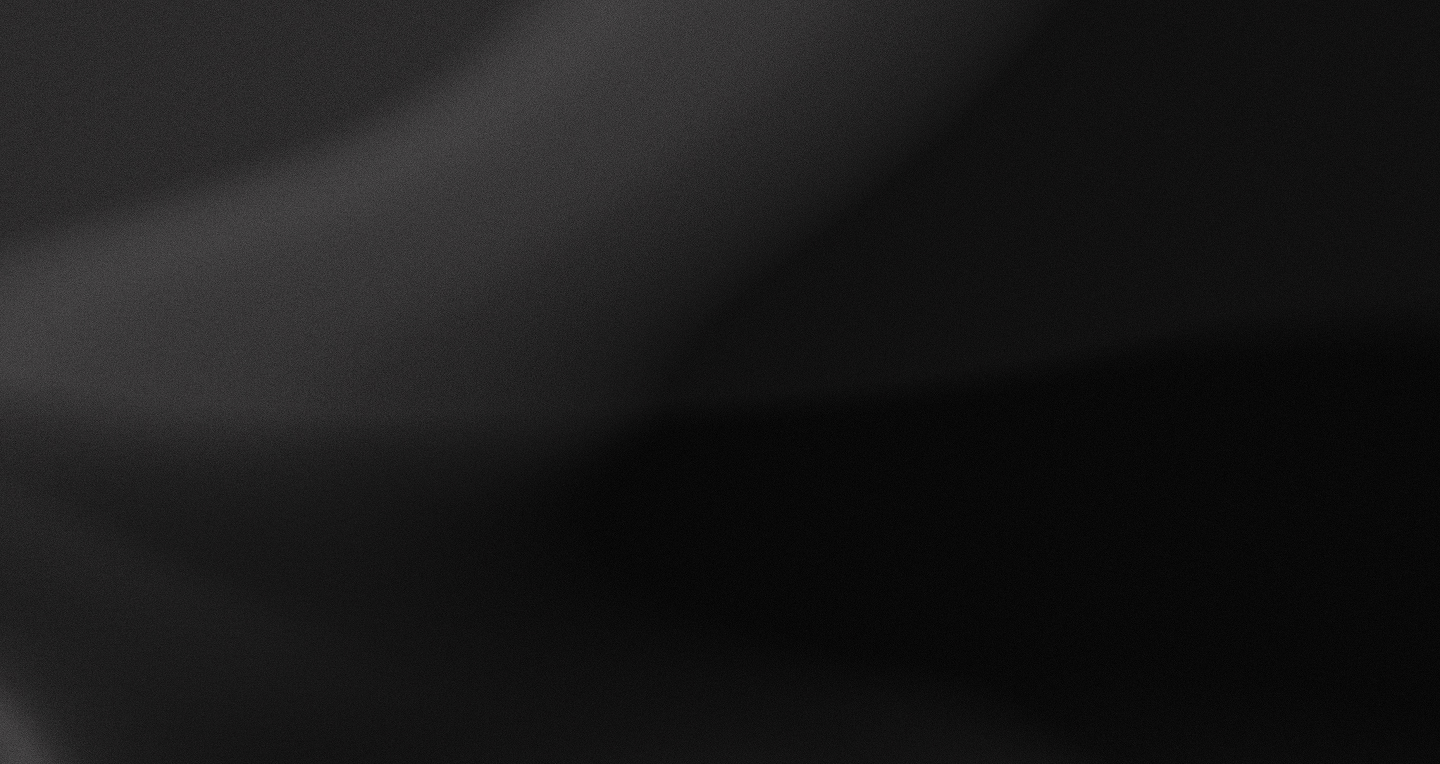 Abstract black and dark gray gradient background with smooth curved shadows.