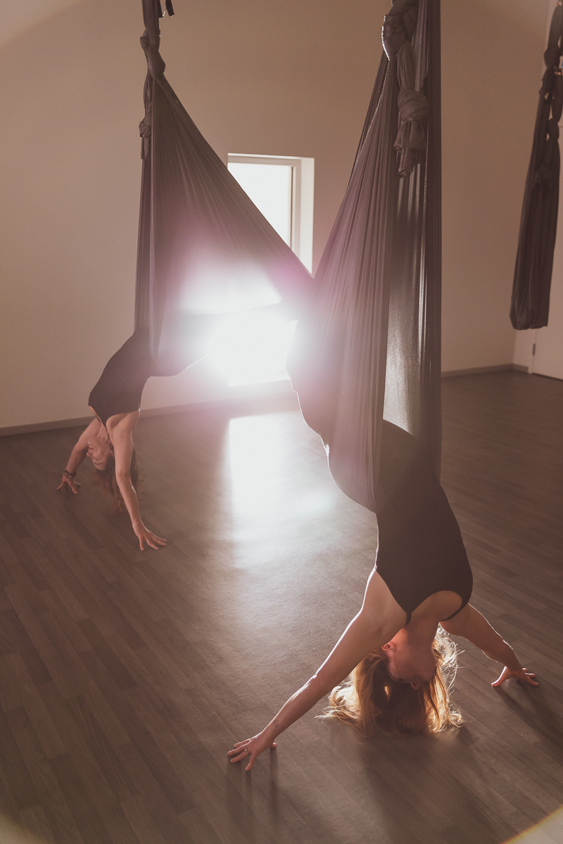 commercial photography of women doing aerial yoga at a luxury resort in arizona