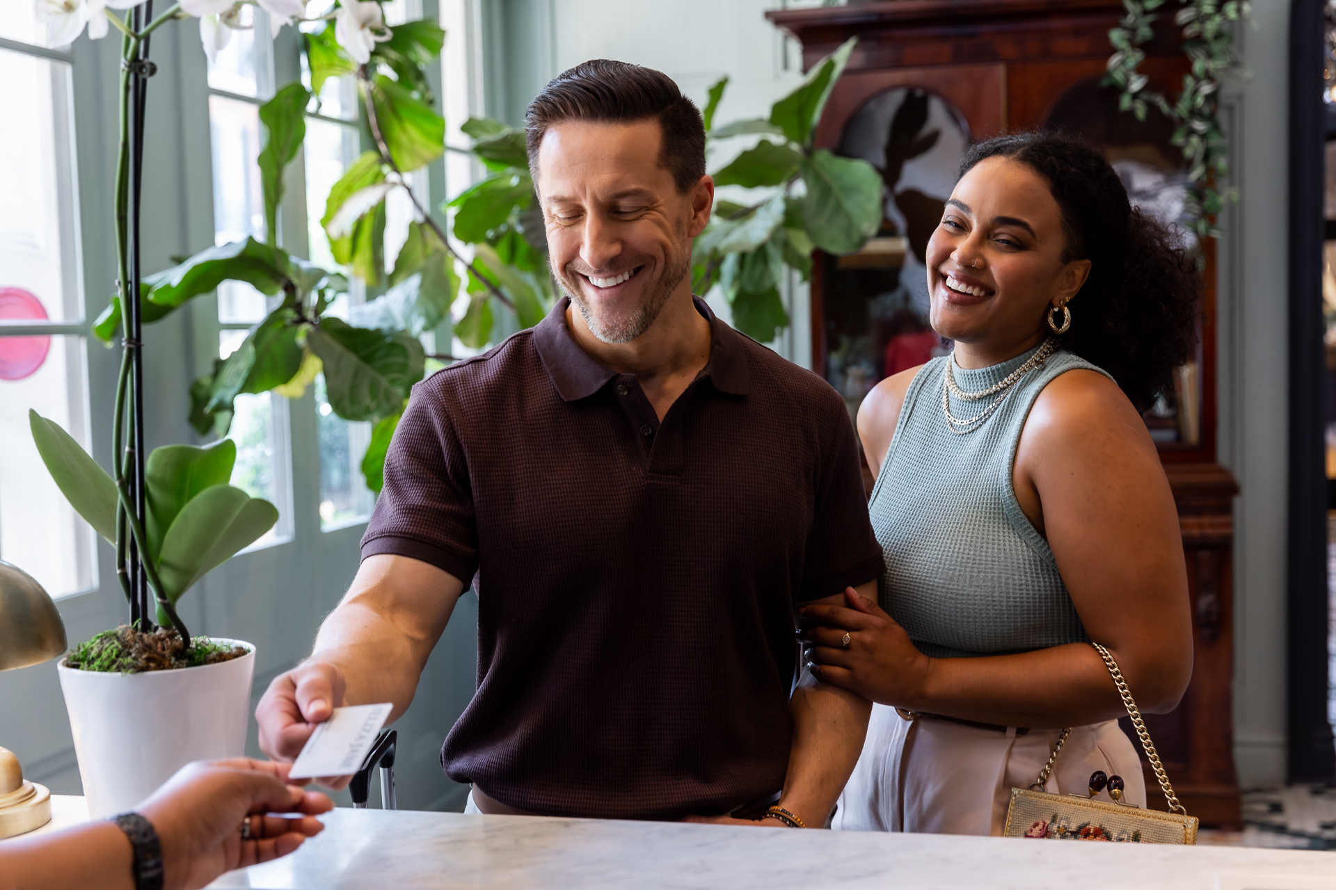 commercial photo of a couple checking into a hotel