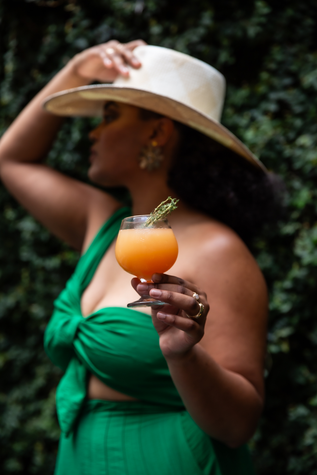 commercial photography of a woman holding a cocktail 