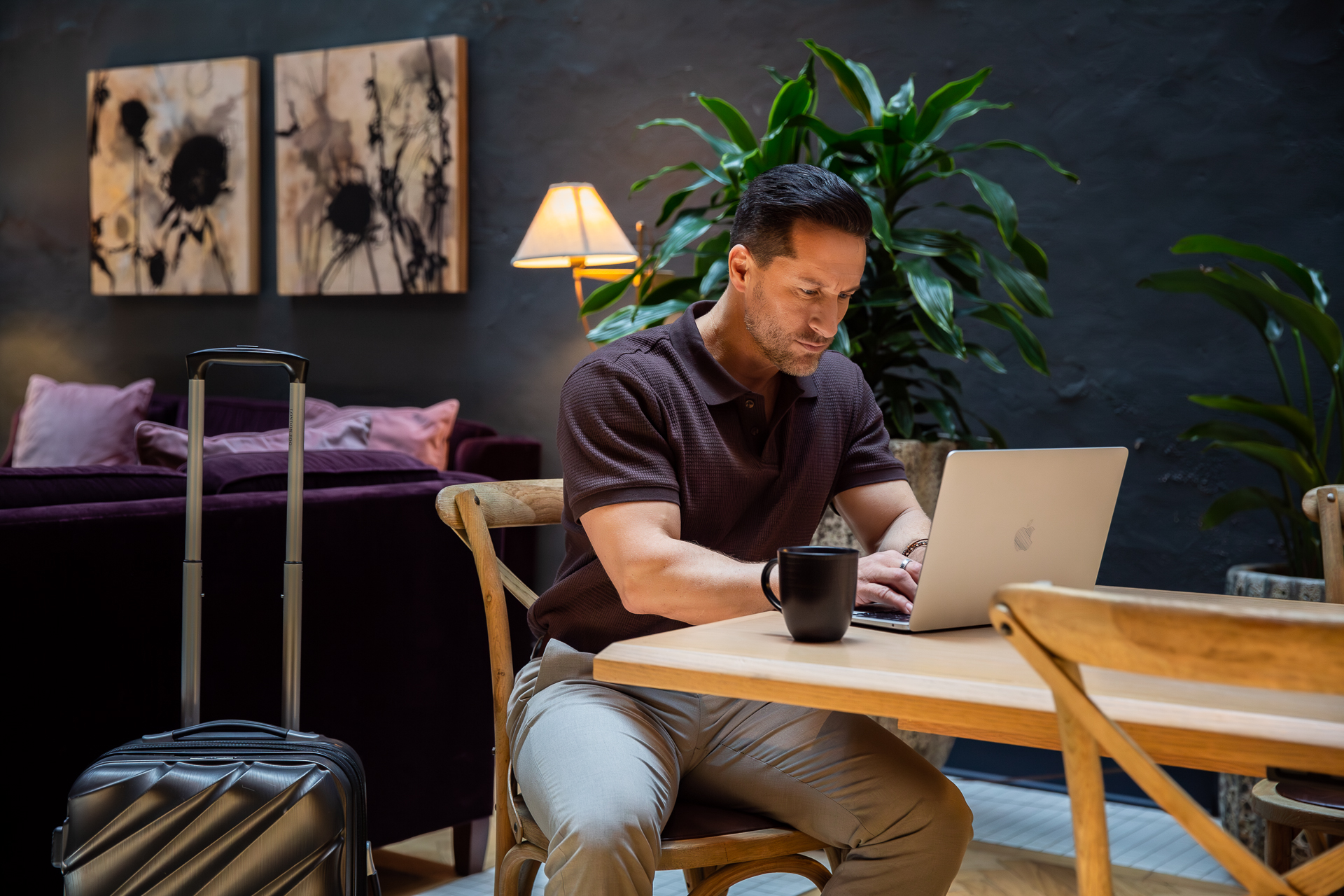 commercial photography of a man working on his laptop at Eliza Jane hotel in New Orleans