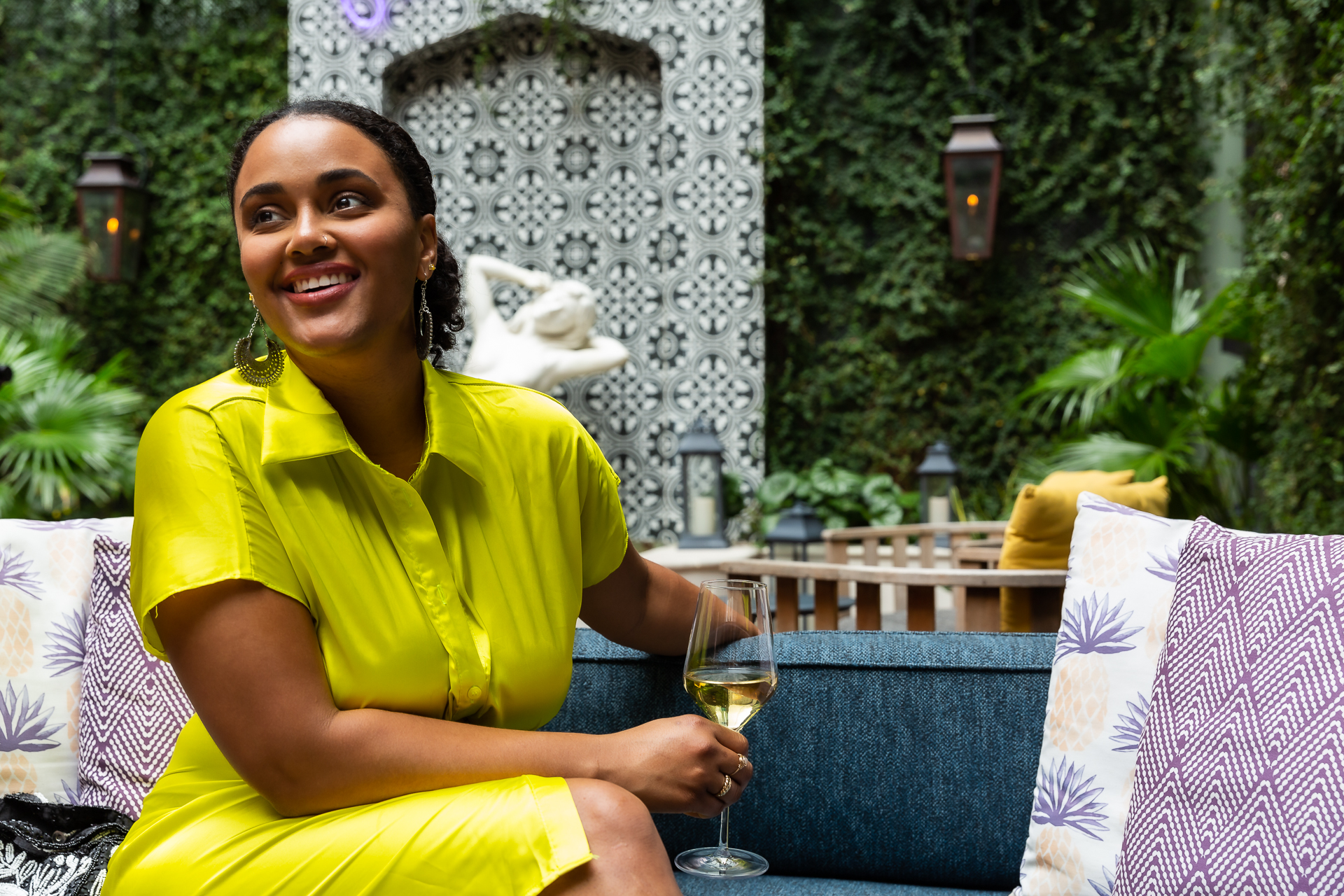 commercial photography of a woman with glass of wine at Eliza Jane hotel in New Orleans