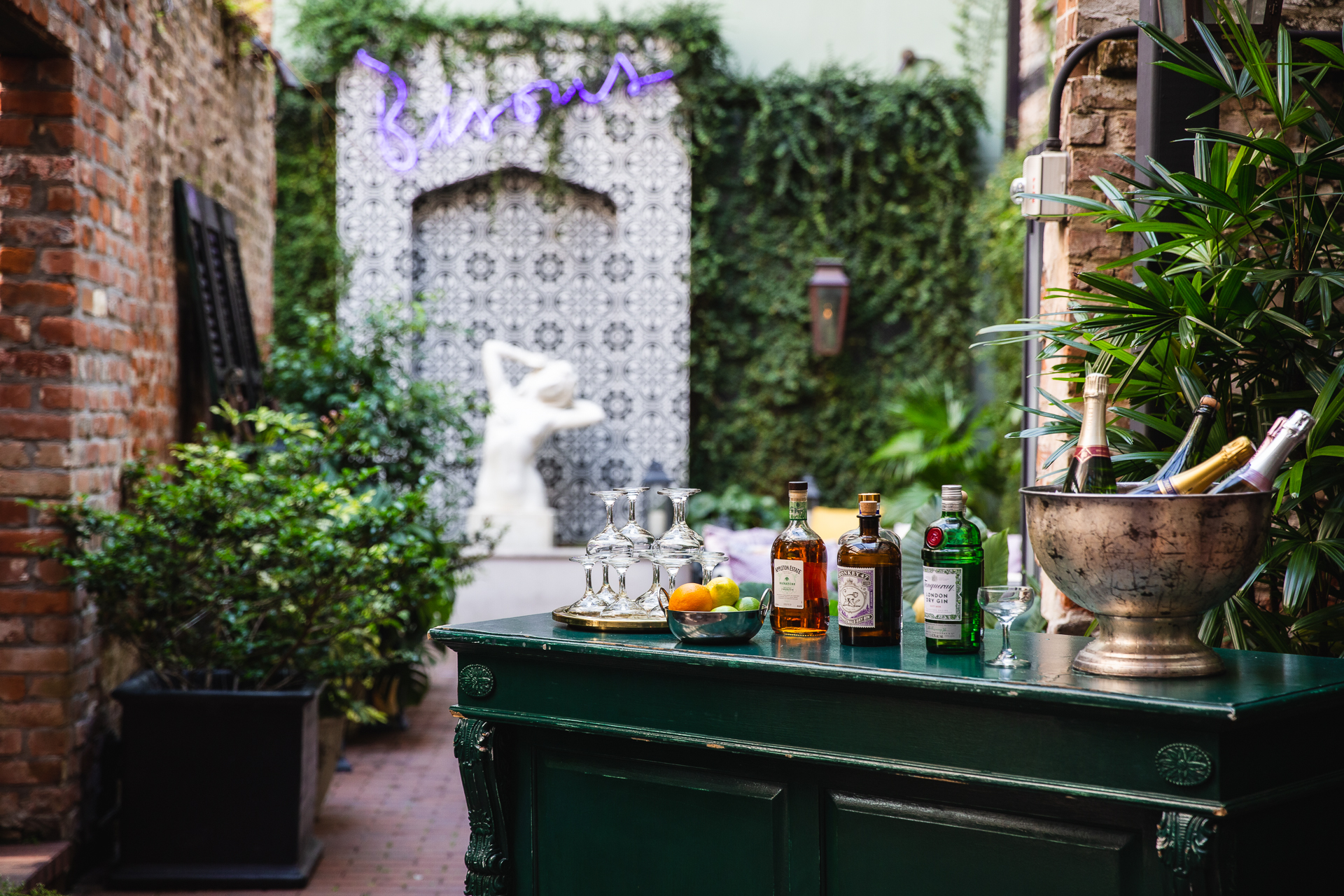 commercial photography of a courtyard bar at Eliza Jane hotel in New Orleans