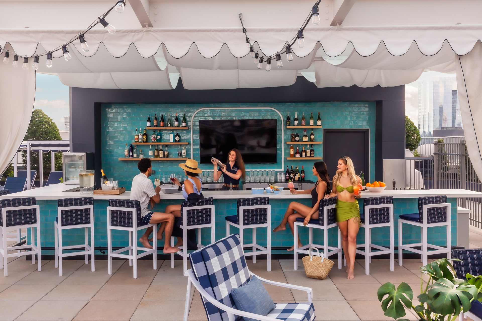 commercial photo of friends by an outdoor bar