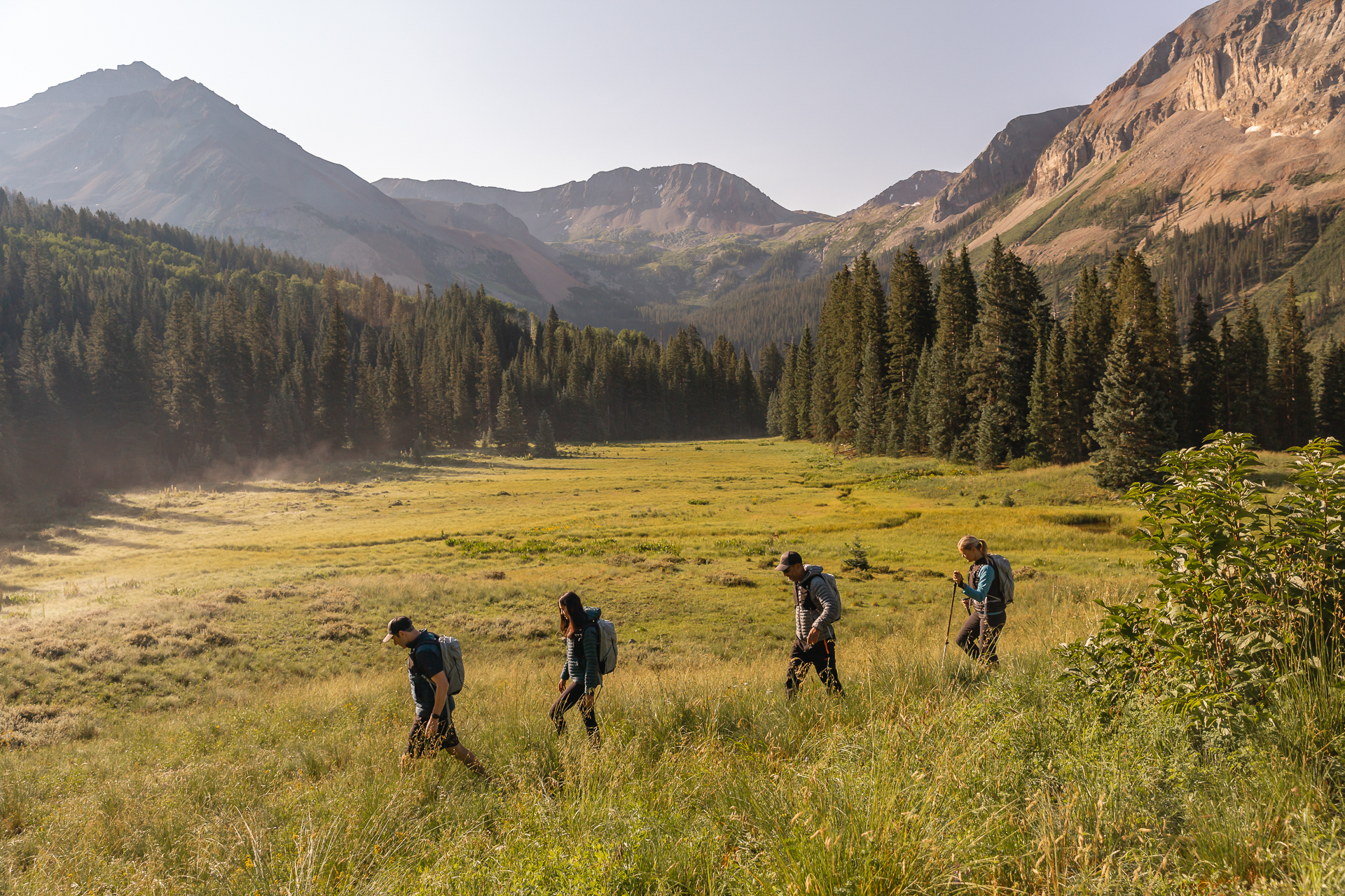commercial photography of a group of four people hiking through a valley in Telluride, Colorado